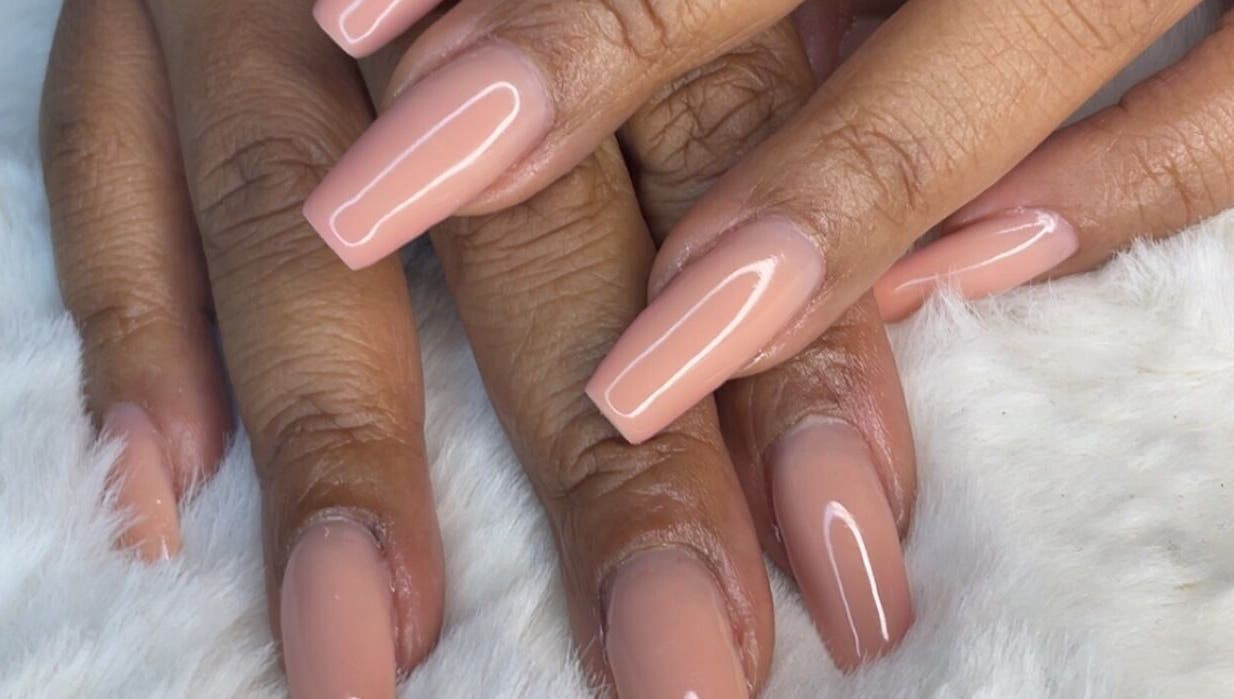 Elegant manicured nails at Yarnique Nails, Randburg, Gauteng, ZA on a soft white background.