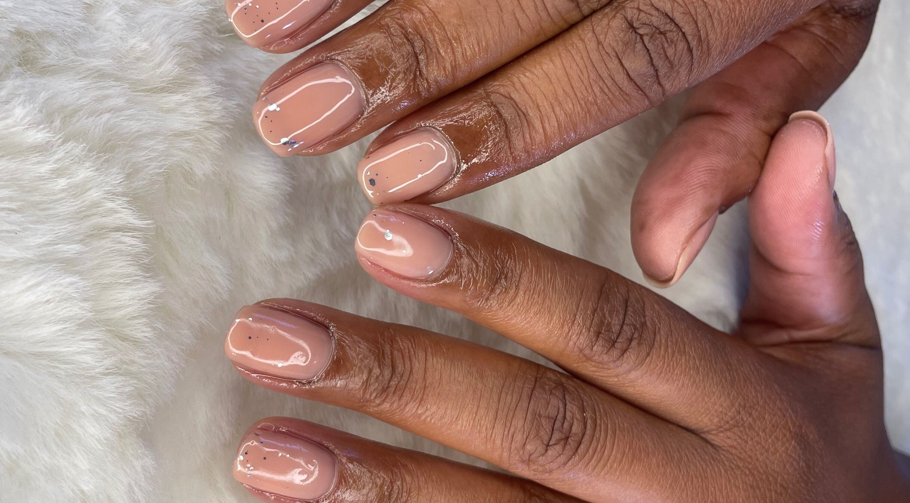 Elegant nude nails at Yarnique Nails located in Randburg, Gauteng, ZA, showcasing precise manicure artistry.