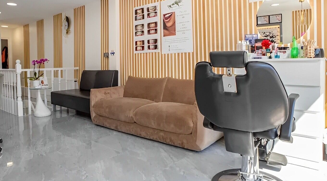 Interior of Paradise HM beauty salon featuring modern seating in London, England, GB.