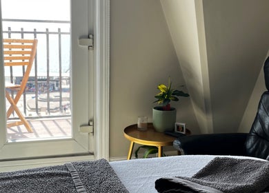 Relaxing massage room at Selah Massage Therapy, Bournemouth, England, GB with a sea view.