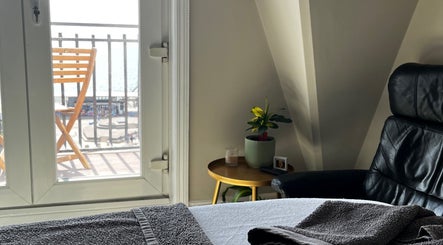 Relaxing massage room at Selah Massage Therapy, Bournemouth, England, GB with a sea view.