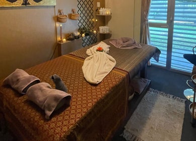 Serene massage room at GrandRelax@ThaiMassage, Ascona, Ticino, CH with soft lighting and a tranquil atmosphere.