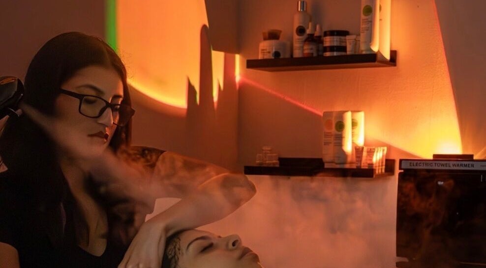 Relaxing facial treatment at Soluna Skin Studio in Durham, North Carolina, US with warm ambiance and skincare products.