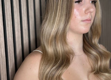 Elegant blonde waves styled at Olivia Tyman Hair Design, Elland, England, GB.