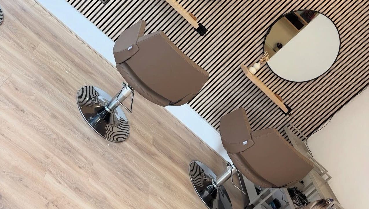 Modern salon chairs at Olivia Tyman Hair Design, Elland, England, GB, showcasing sleek design and elegance.