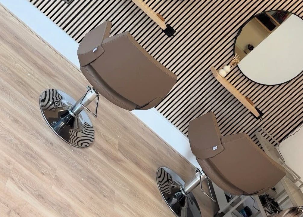 Modern salon chairs at Olivia Tyman Hair Design, Elland, England, GB, showcasing sleek design and elegance.