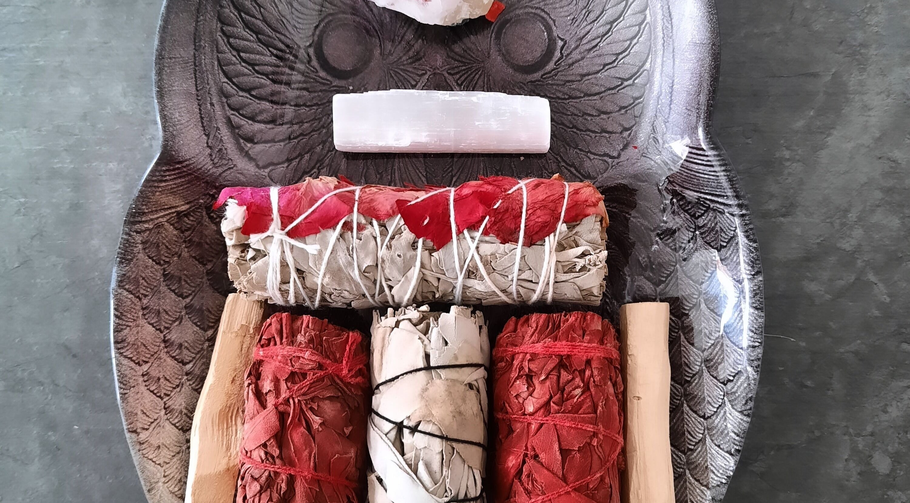Variety of smudge sticks on carved tray at Rehab Holistic Therapies, Kilmarnock, Scotland, GB.