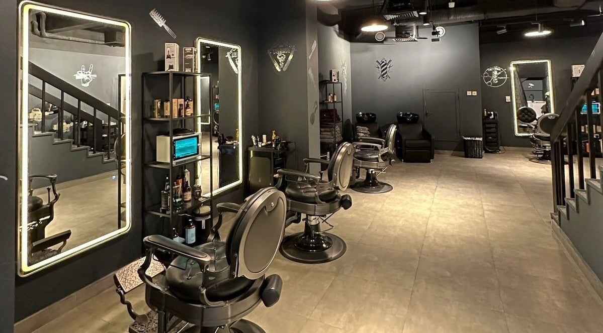 Modern grooming area at Spectre Gents Salon & Spa صالون سبيكتر للرجال, Abu Dhabi, AE with sleek barber chairs.
