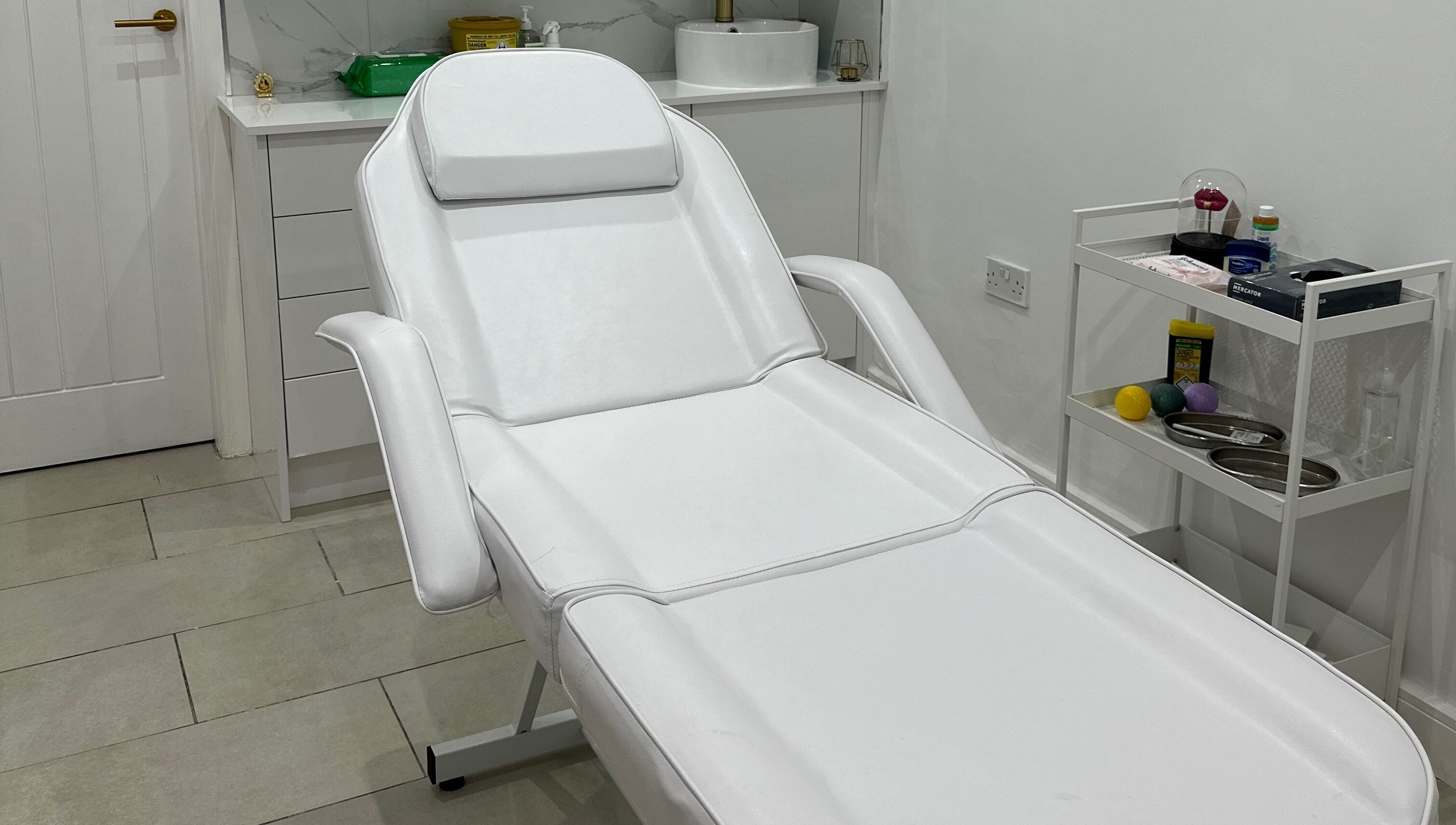 Comfortable treatment bed at Clear Touch Medical Aesthetics, Dudley, England, GB.