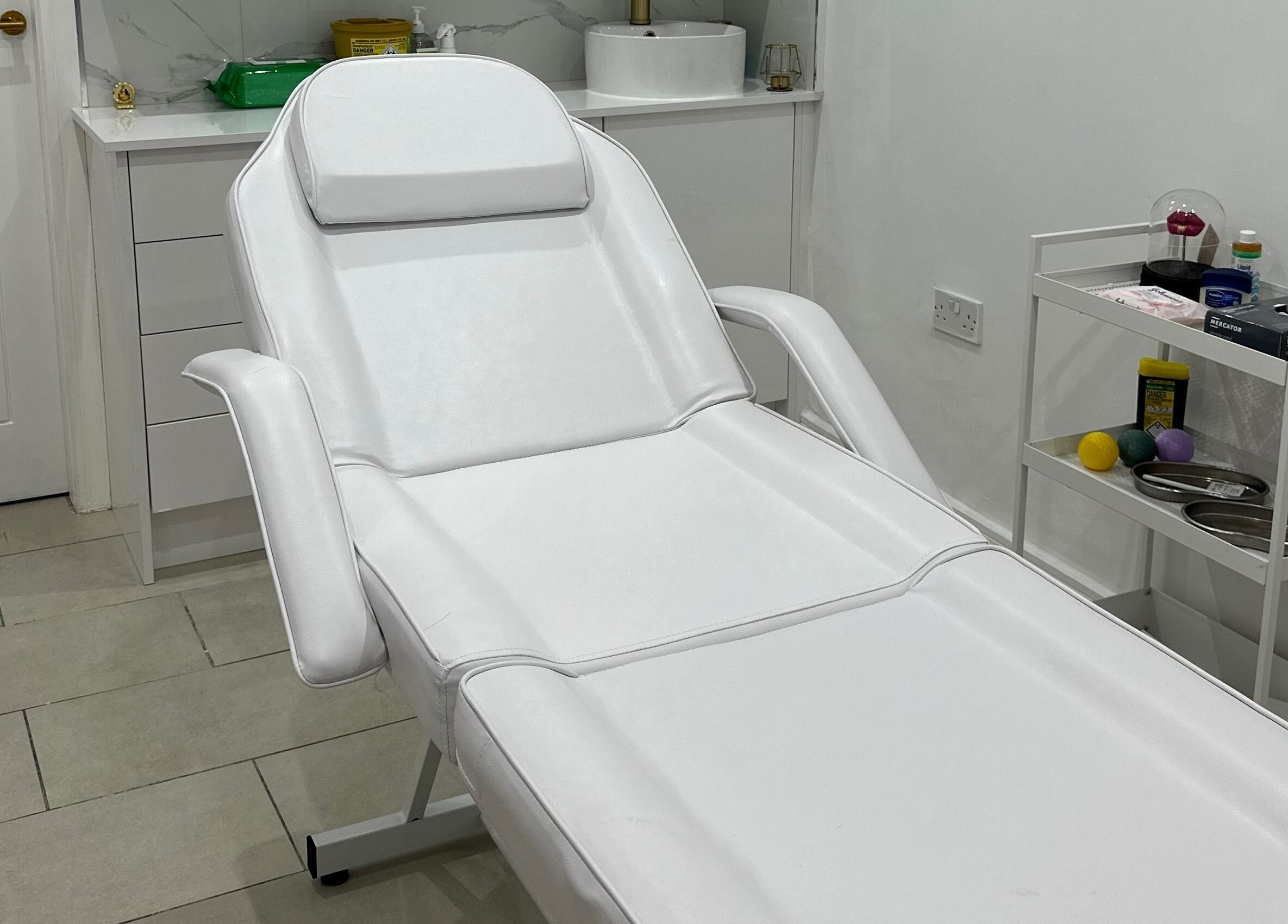 Comfortable treatment bed at Clear Touch Medical Aesthetics, Dudley, England, GB.
