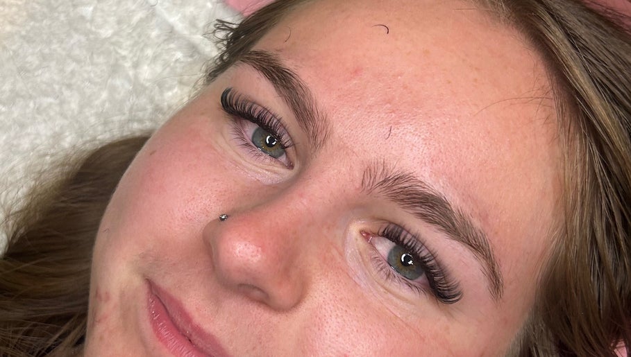 Close-up of a woman's face with lush eyelashes at ttsbeautybar_ in Crawley, England, GB.