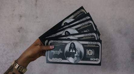 Hand holding Browers branded money at Browers, Dubbo, New South Wales, AU, showcasing beauty and wellness services.