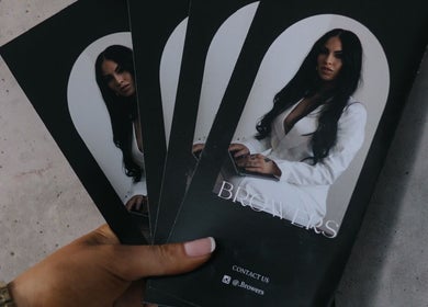 Hand holding Browers brochures showcasing beauty services in Dubbo, New South Wales, AU.