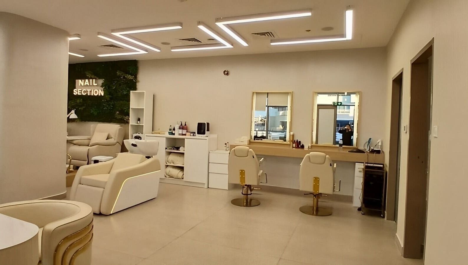 Chic interior of Hair Space Ladies Salon by Zain & Steve in Abu Dhabi, AE, featuring nail and hair sections.