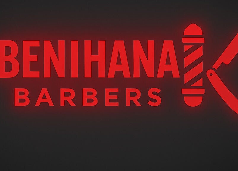Benihana Barbers neon sign in Papamoa, Bay Of Plenty, NZ. Red glowing text and barber pole design.