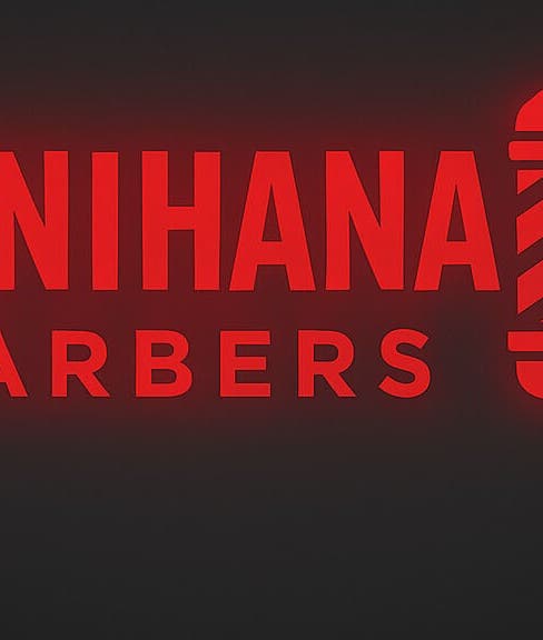 Neon sign of Benihana Barbers, Papamoa, Bay Of Plenty, NZ, with bold red letters.