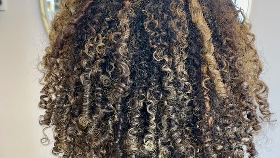 Beautifully styled curly hair at KW Hairdressing in Braywoodside, England, GB showcasing vibrant texture.