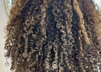Beautifully styled curly hair at KW Hairdressing in Braywoodside, England, GB showcasing vibrant texture.