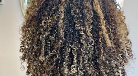 Beautifully styled curly hair at KW Hairdressing in Braywoodside, England, GB showcasing vibrant texture.