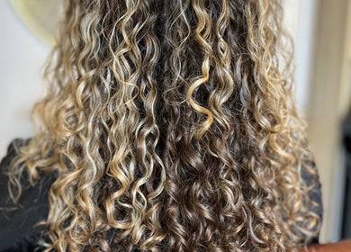 Close-up of styled curly hair at KW Hairdressing, Braywoodside, England, GB.