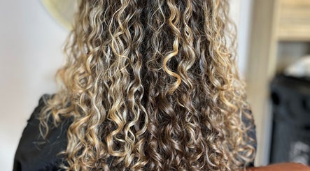 Close-up of styled curly hair at KW Hairdressing, Braywoodside, England, GB.