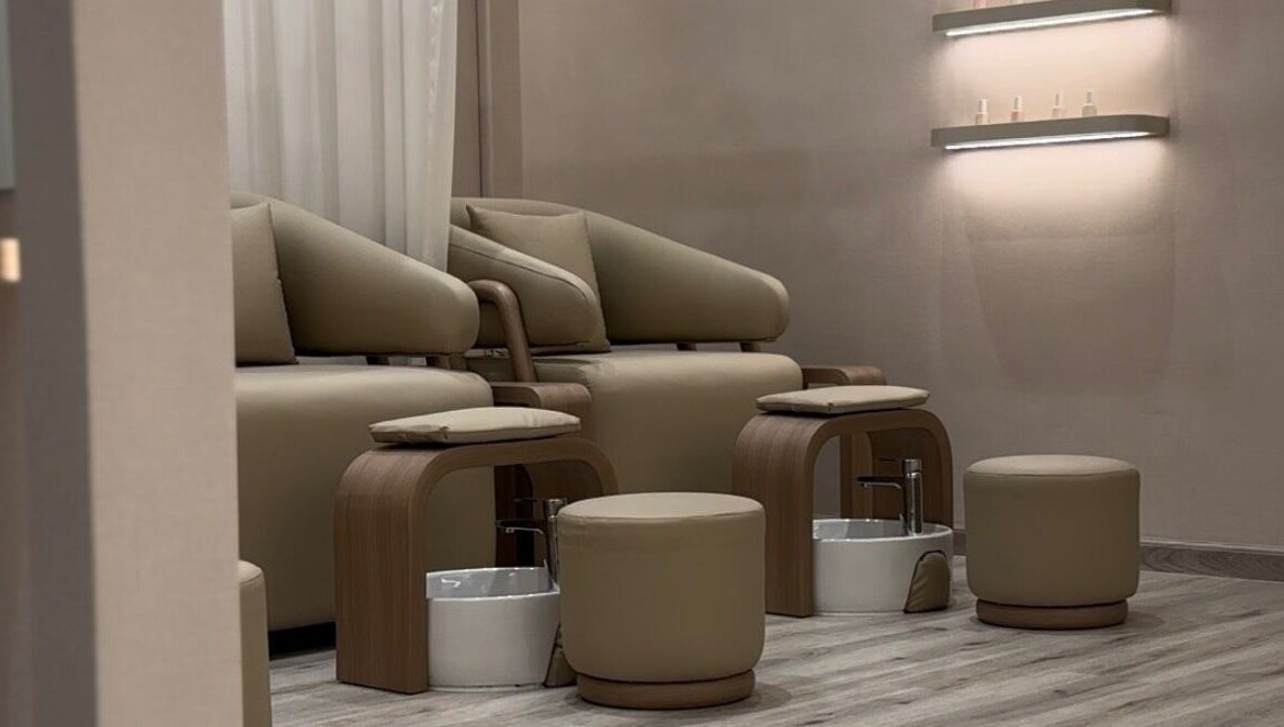 Luxurious pedicure chairs at Beauty Bloom Salon in دبي, دبي, AE with warm, inviting decor.