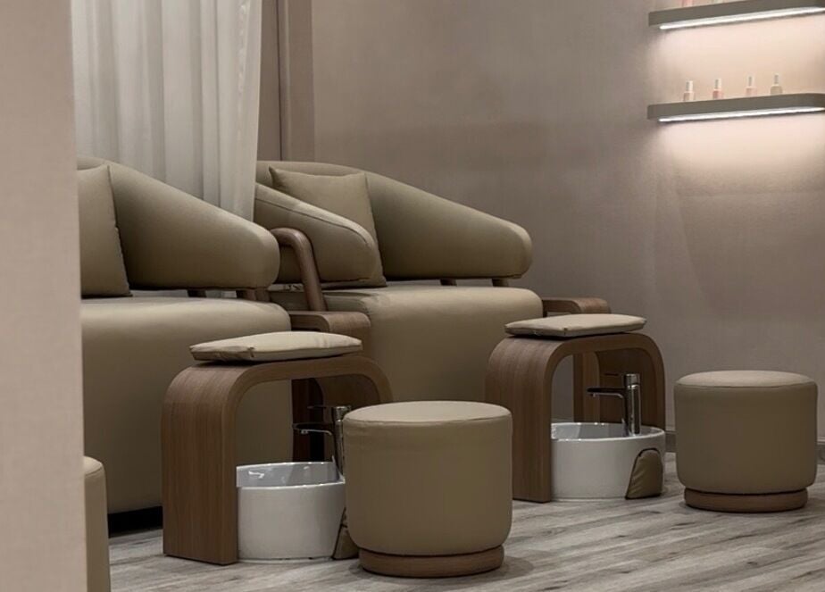 Luxurious pedicure chairs at Beauty Bloom Salon in دبي, دبي, AE with warm, inviting decor.