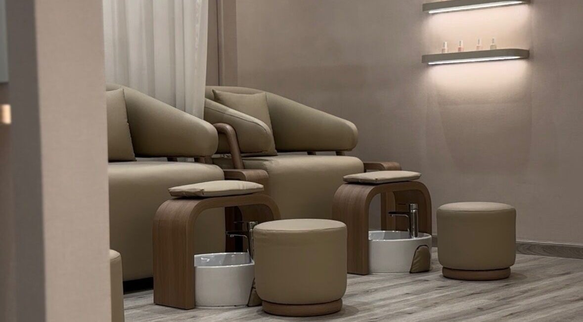Luxurious pedicure chairs at Beauty Bloom Salon in دبي, دبي, AE with warm, inviting decor.