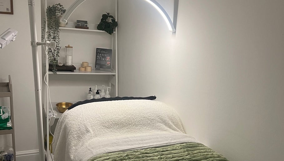 Cozy treatment room at Emerald Skin Studio in London, England, GB, showcasing a serene and inviting ambiance.