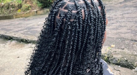 Intricate braided hairstyle at Slayed by.j in Charlotte, VC showcasing professional beauty craftsmanship.
