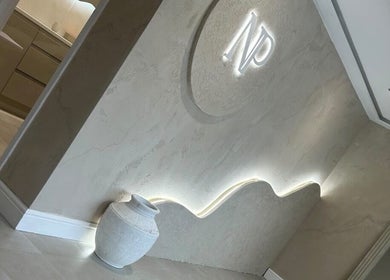 Elegant interior wall with illuminated design at Blushed By Talia, Cockermouth, England, GB.
