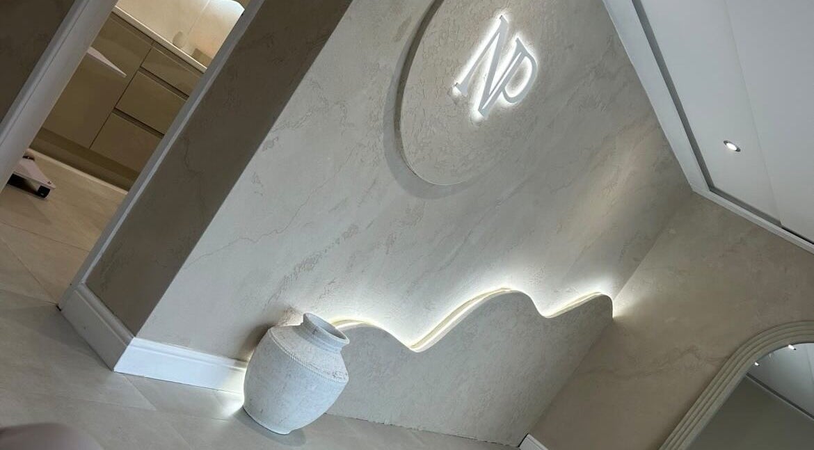 Elegant interior wall with illuminated design at Blushed By Talia, Cockermouth, England, GB.