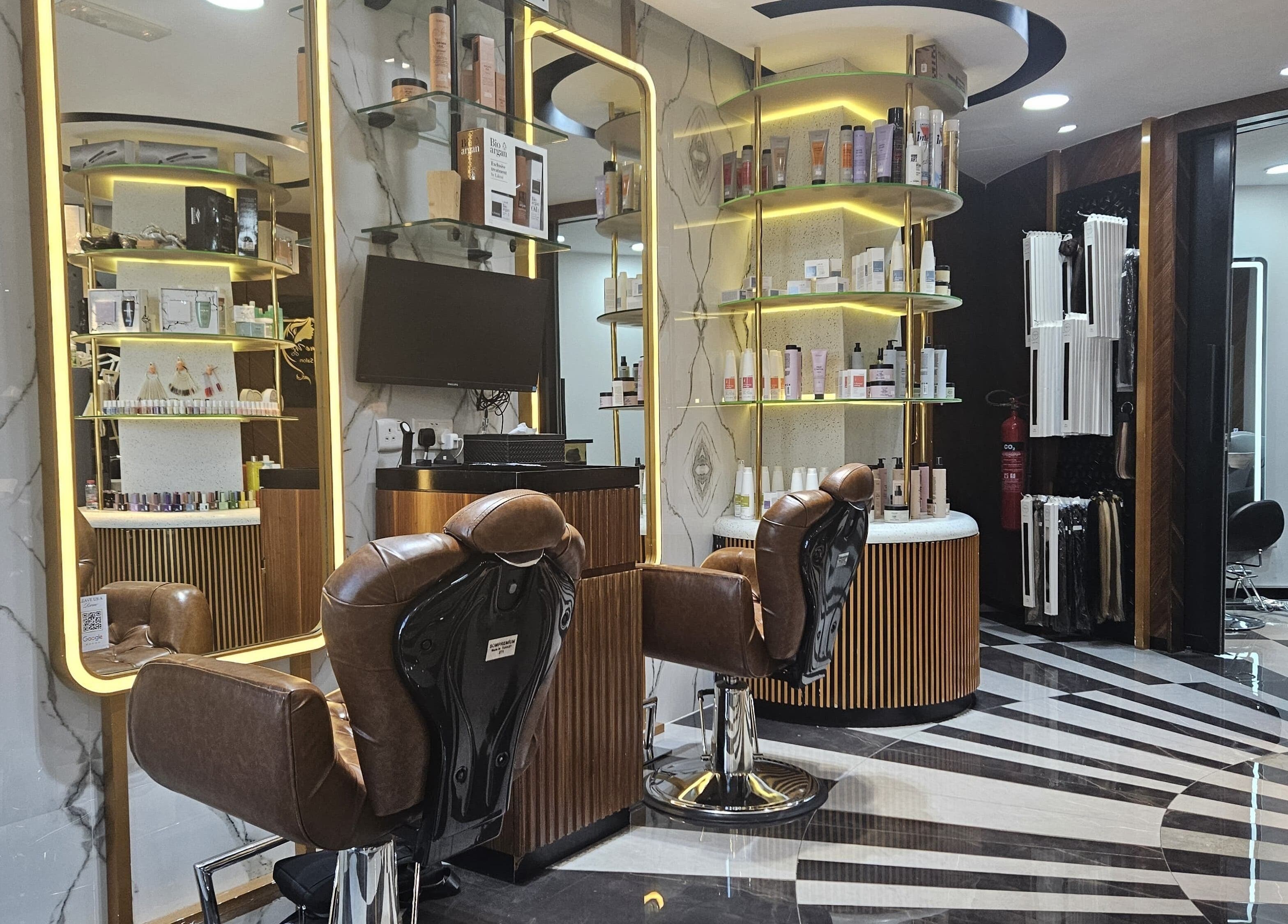Luxurious interior of Style Me Up Beauty Salon in Dubai, Dubai, AE with stylish chairs and shelves of beauty products.