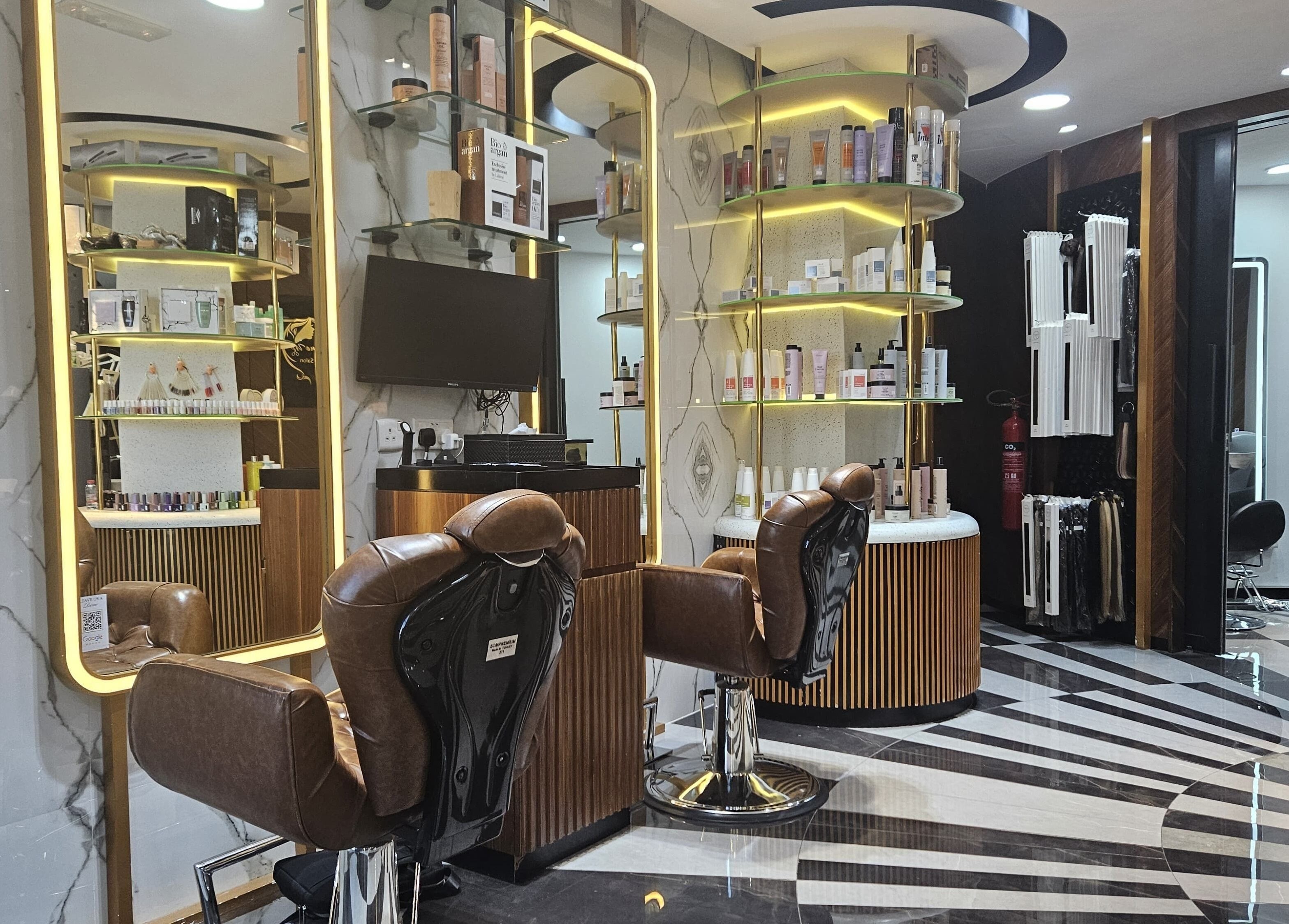 Luxurious interior of Style Me Up Beauty Salon in Dubai, Dubai, AE with stylish chairs and shelves of beauty products.