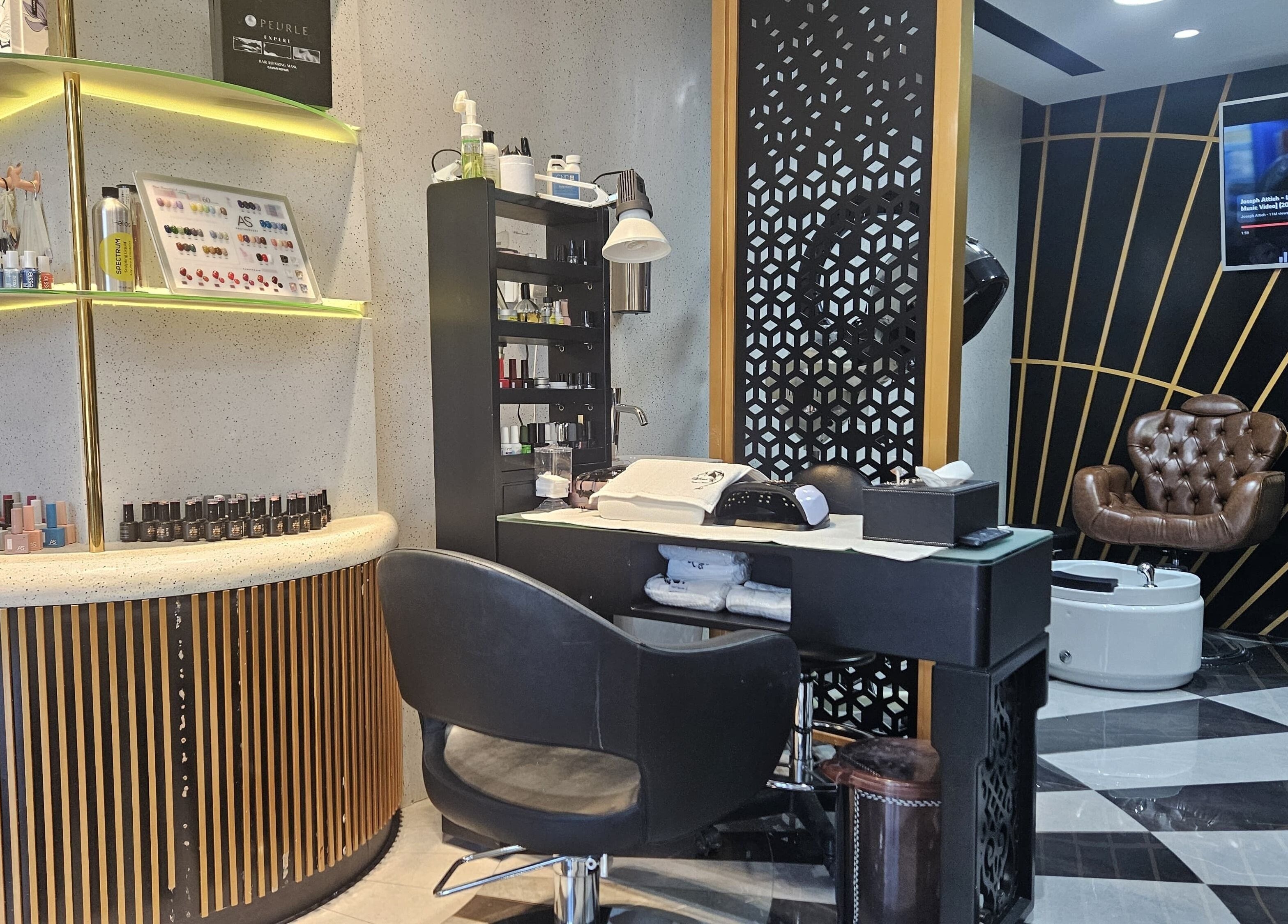 Modern styling station at Style Me Up Beauty Salon, Dubai, Dubai, AE, featuring elegant décor and nail polish display.