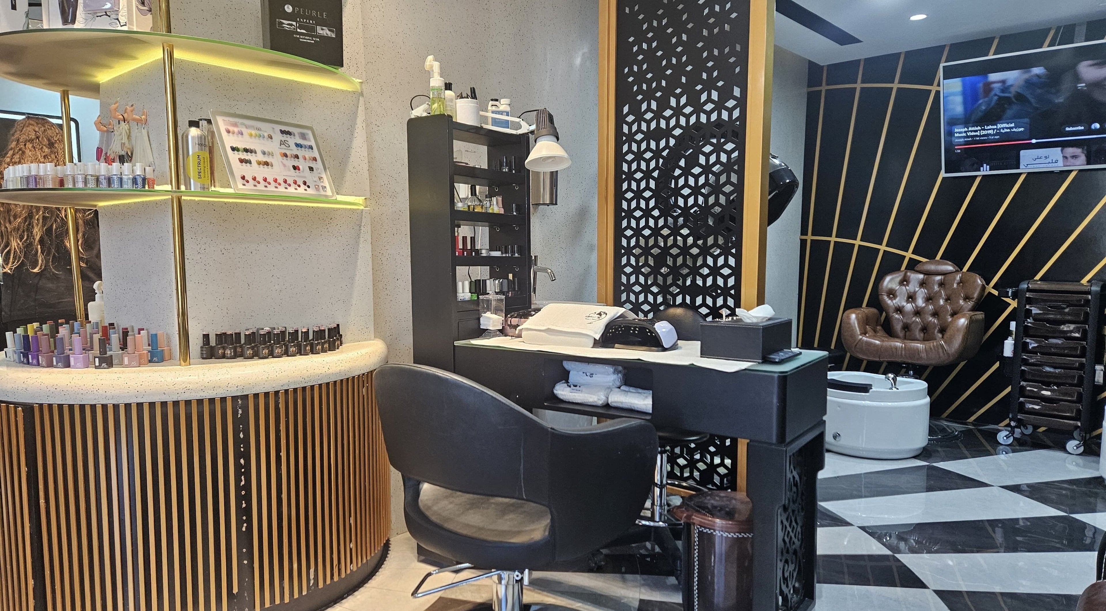 Modern styling station at Style Me Up Beauty Salon, Dubai, Dubai, AE, featuring elegant décor and nail polish display.