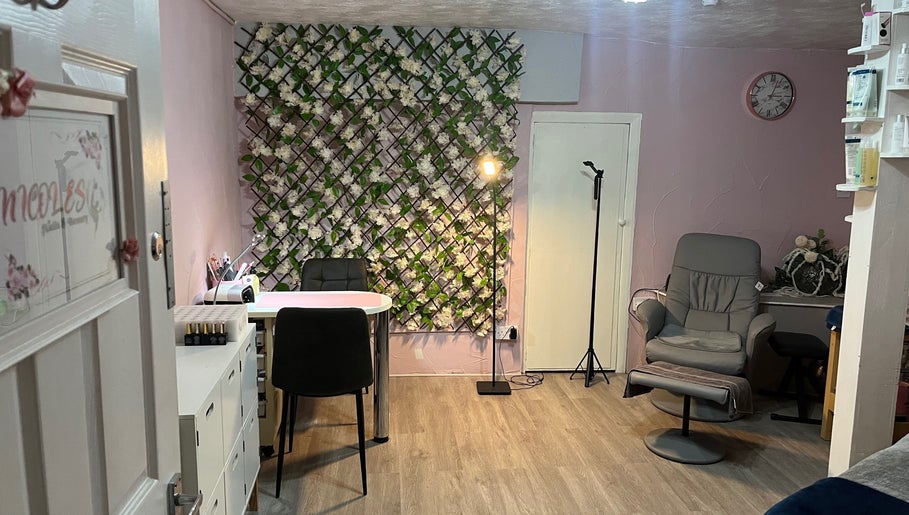 Stylish interior of Nicole's Nails & Beauty in Eastbourne, England, GB with floral decor and comfortable seating.