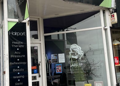 Front of Nicole's Nails & Beauty in Eastbourne, England, GB showcasing salon sign and cozy decor.