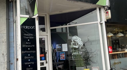Front of Nicole's Nails & Beauty in Eastbourne, England, GB showcasing salon sign and cozy decor.