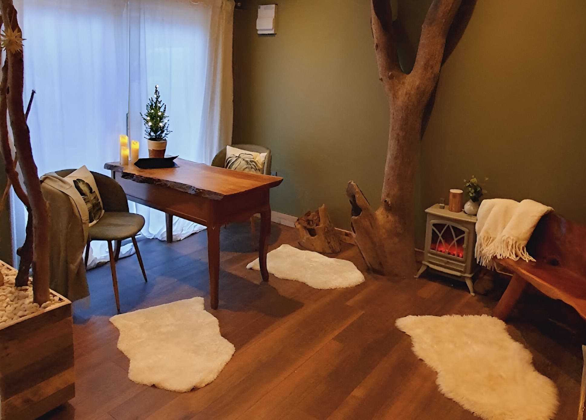 A cozy, rustic room at The Nurture Sanctuary in Broadwindsor, England, GB, featuring warm wood tones.