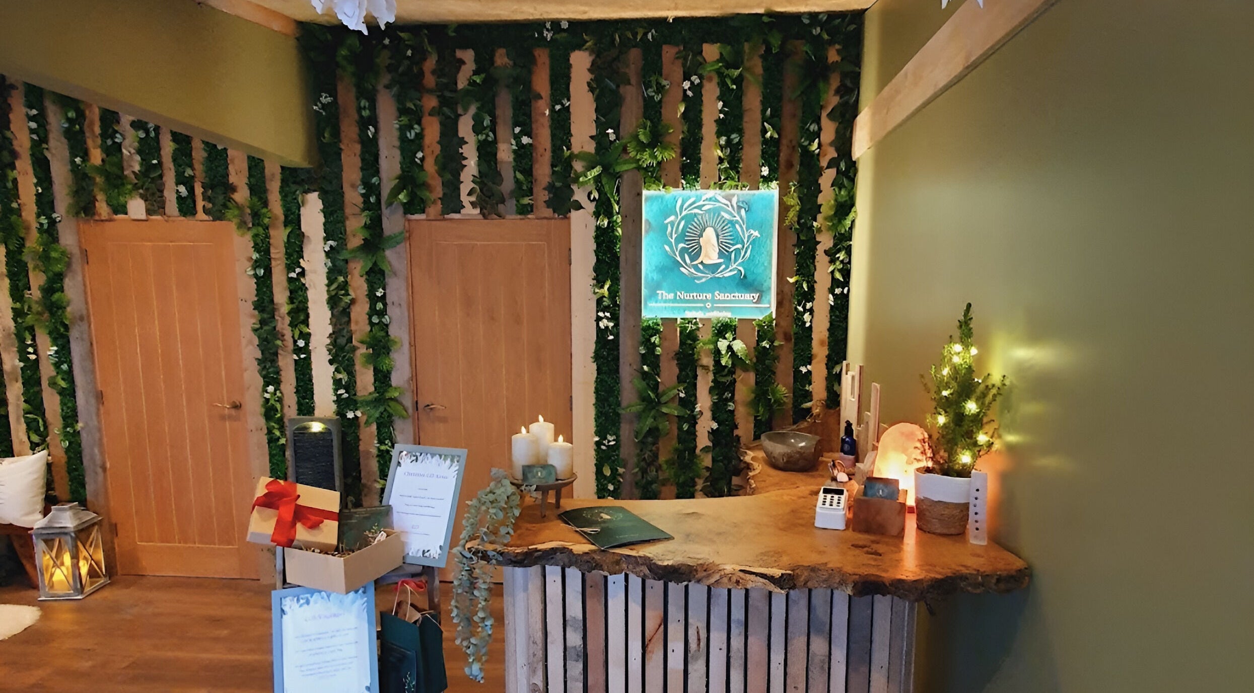 Warm rustic reception at The Nurture Sanctuary in Broadwindsor, England, GB, with greenery and wood accents.