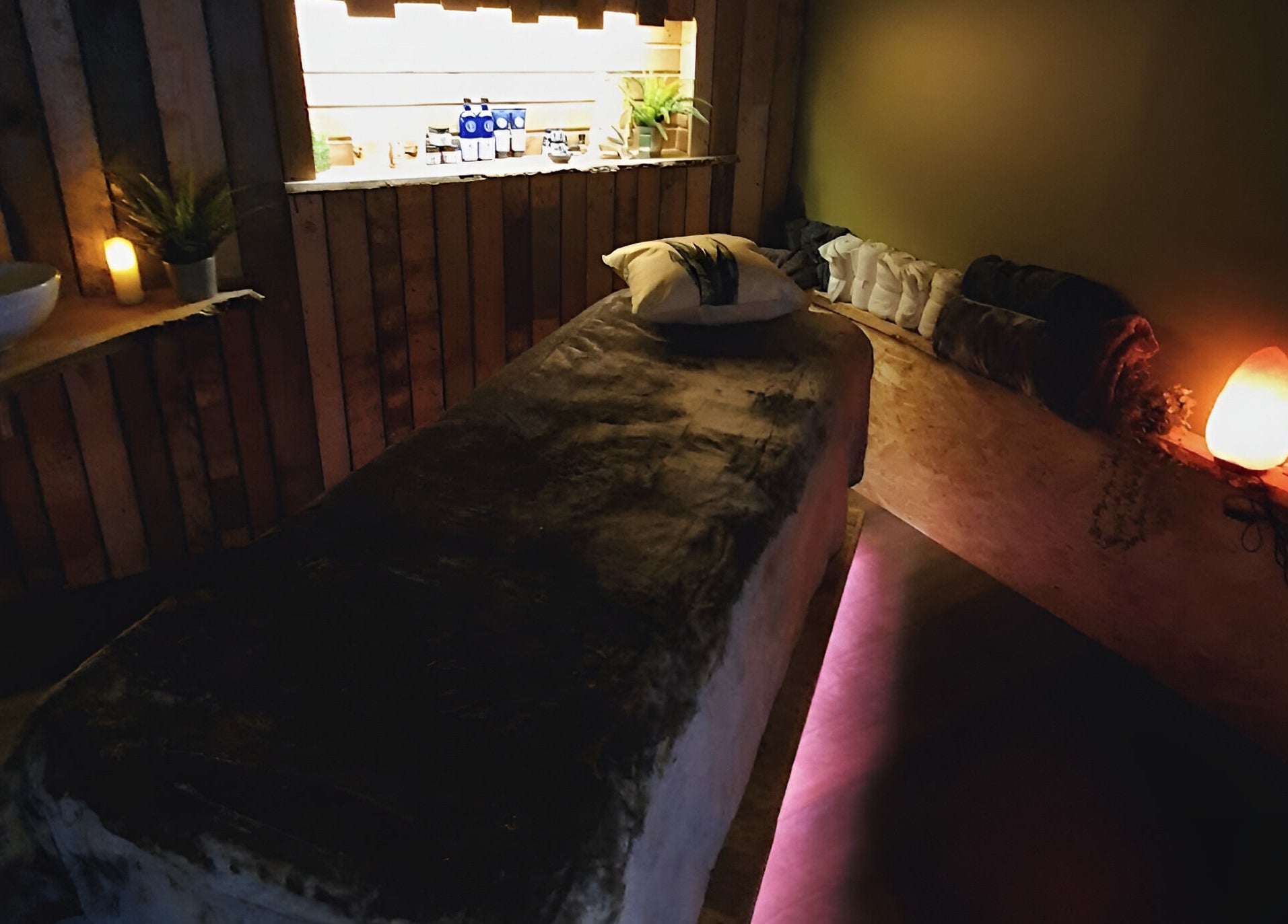 Relaxing therapy room at The Nurture Sanctuary, Broadwindsor, England, GB, with dim lighting and cozy decor.