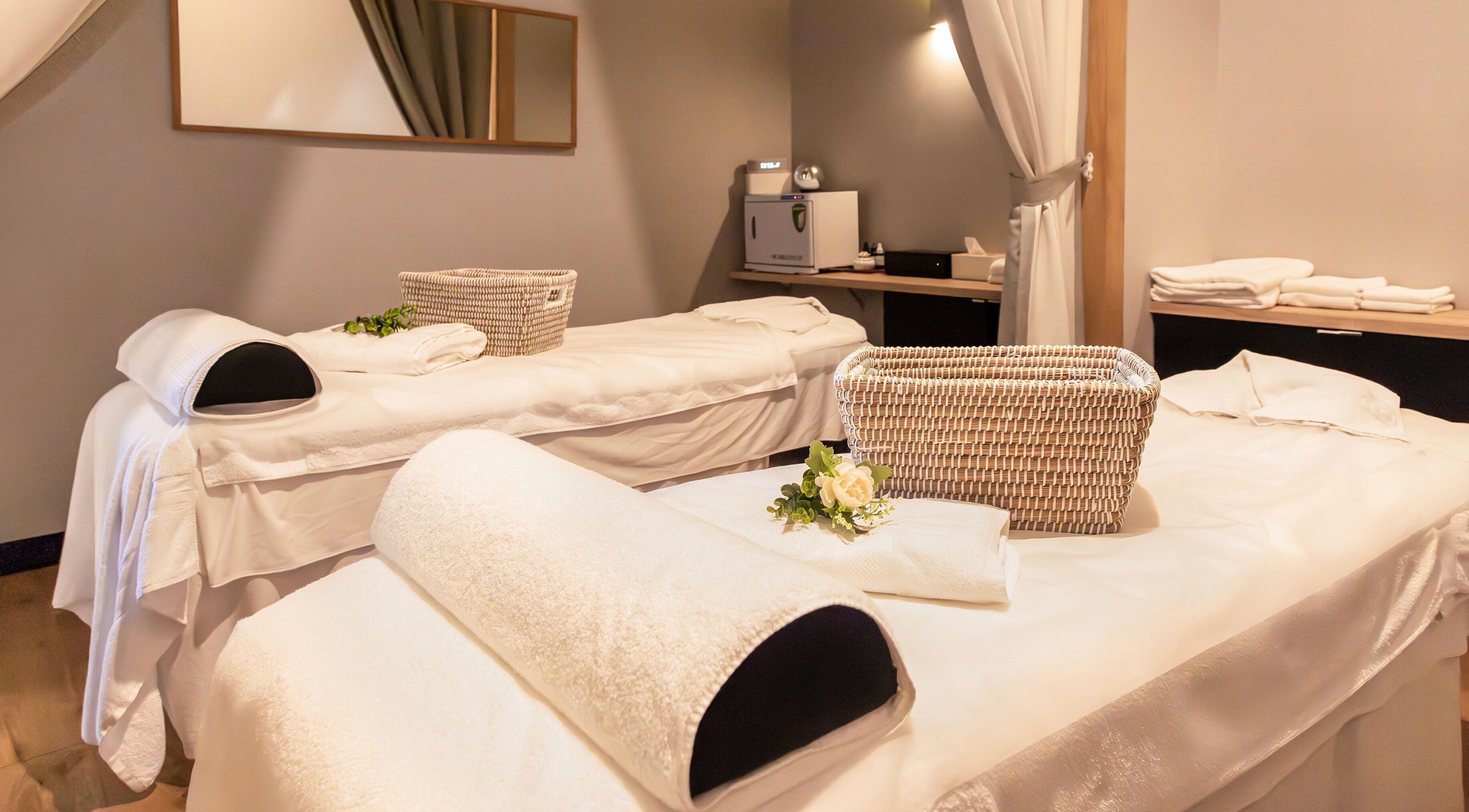 Relaxing massage room at Retreat Massage and Wellness, Southport, Queensland, AU with cozy treatment beds.