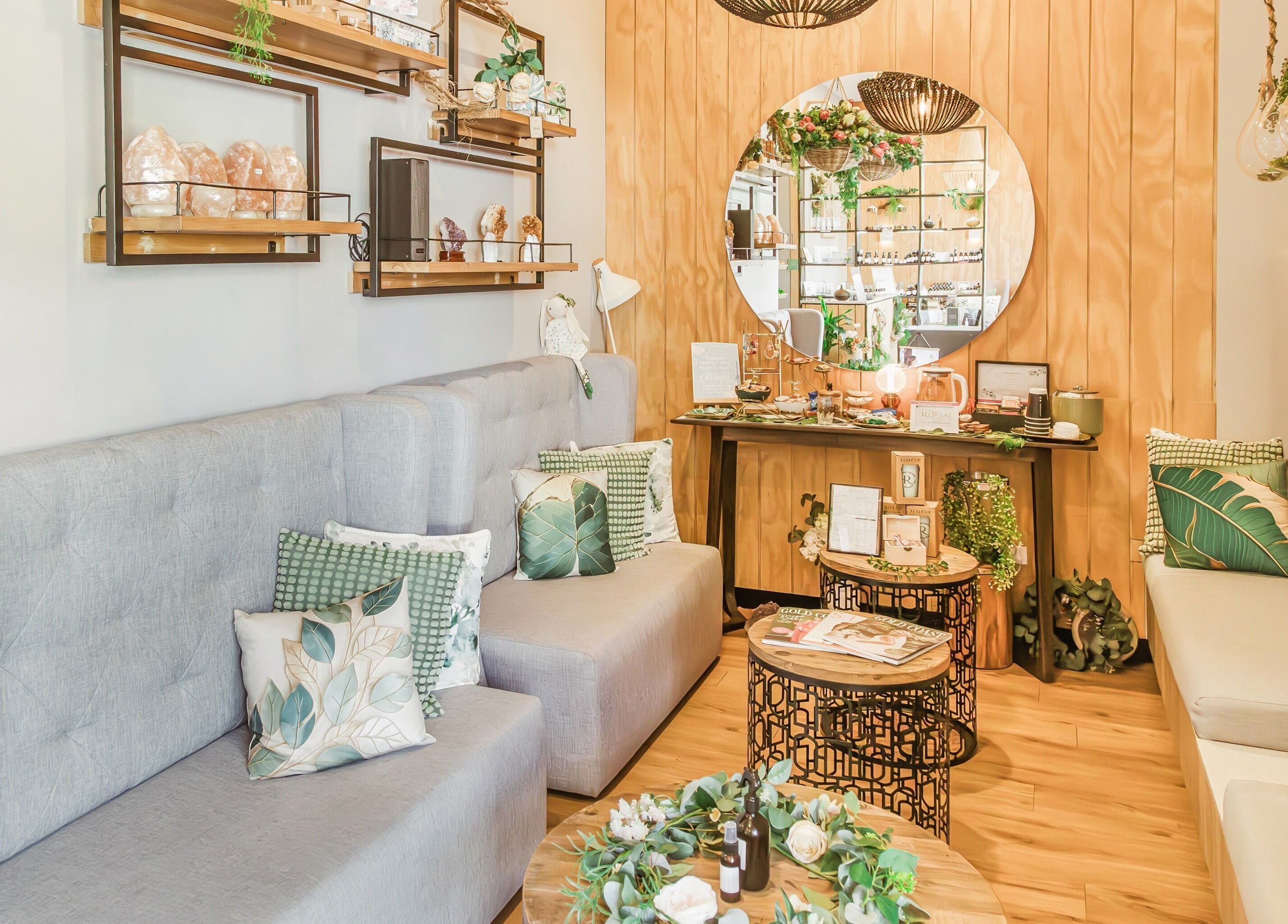 Elegant lounge at Retreat Massage and Wellness, Southport, Queensland, AU with cozy seating and decor.