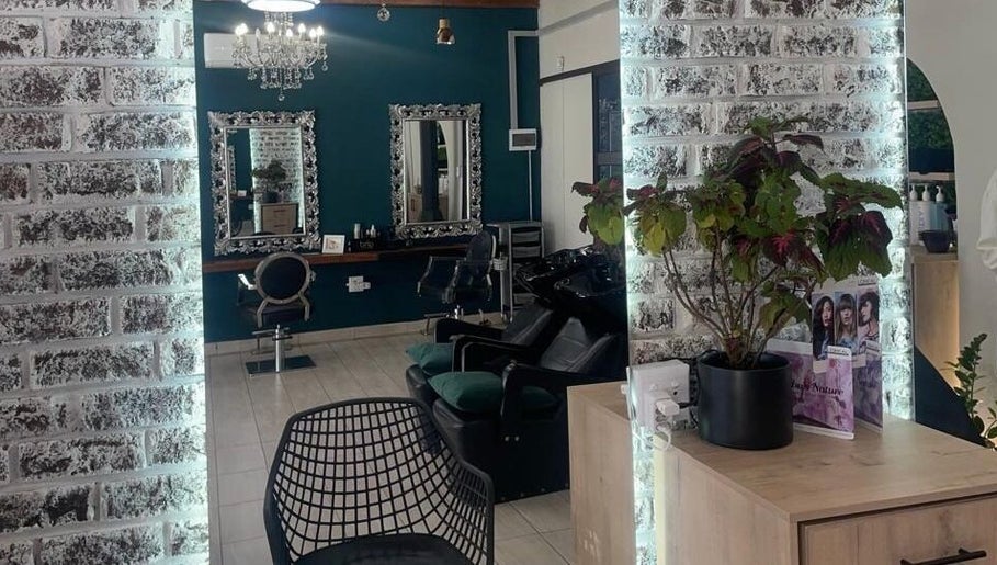 Inside Le Chic Hair & Beauty in Polokwane, Limpopo, ZA: stylish mirrors, chairs, and decor.
