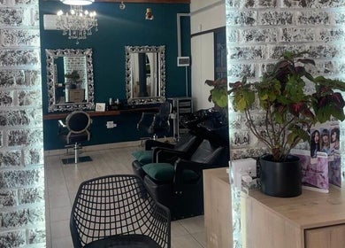 Inside Le Chic Hair & Beauty in Polokwane, Limpopo, ZA: stylish mirrors, chairs, and decor.