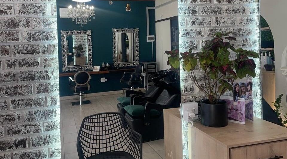 Inside Le Chic Hair & Beauty in Polokwane, Limpopo, ZA: stylish mirrors, chairs, and decor.