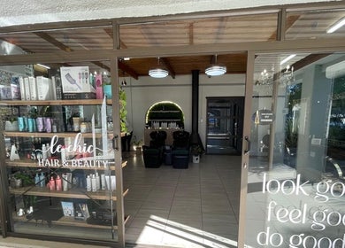 Entrance view of Le Chic Hair & Beauty in Polokwane, Limpopo, ZA, showcasing stylish salon ambiance.