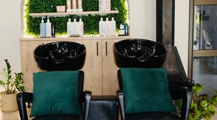 Luxurious wash station at Le Chic Hair & Beauty, Polokwane, Limpopo, ZA, featuring elegant black basins.
