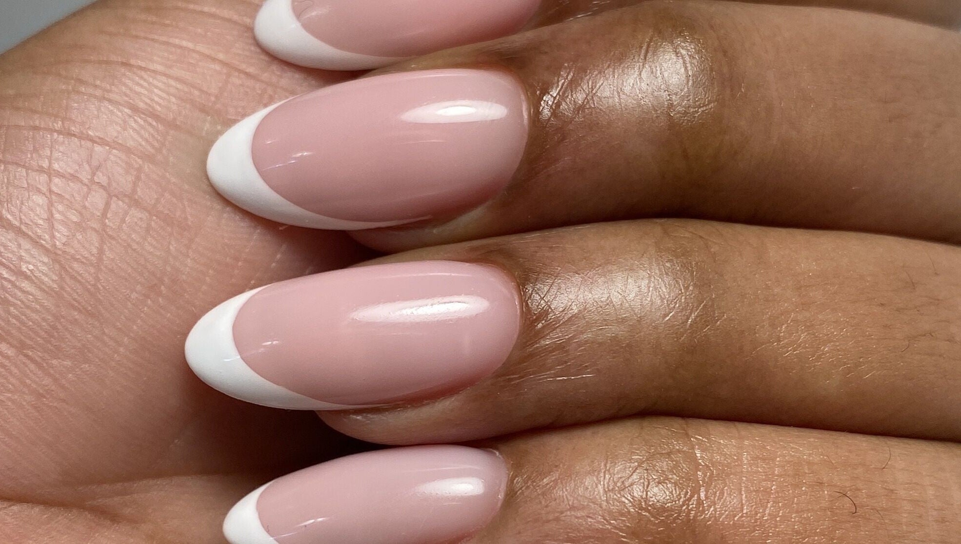 French manicure at Yuliia Nails in Paris, Île-de-France, FR showcasing elegant pink and white tips.